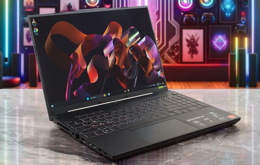 A sleek black Asus TUF Gaming A16 laptop on a marble table